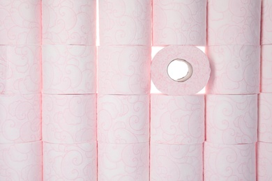 Photo of Many rolls of toilet paper as background, top view