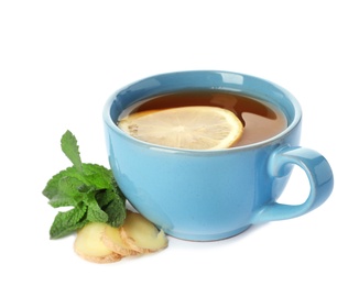 Photo of Cup of tea with lemon, mint and ginger on white background. Cough remedies