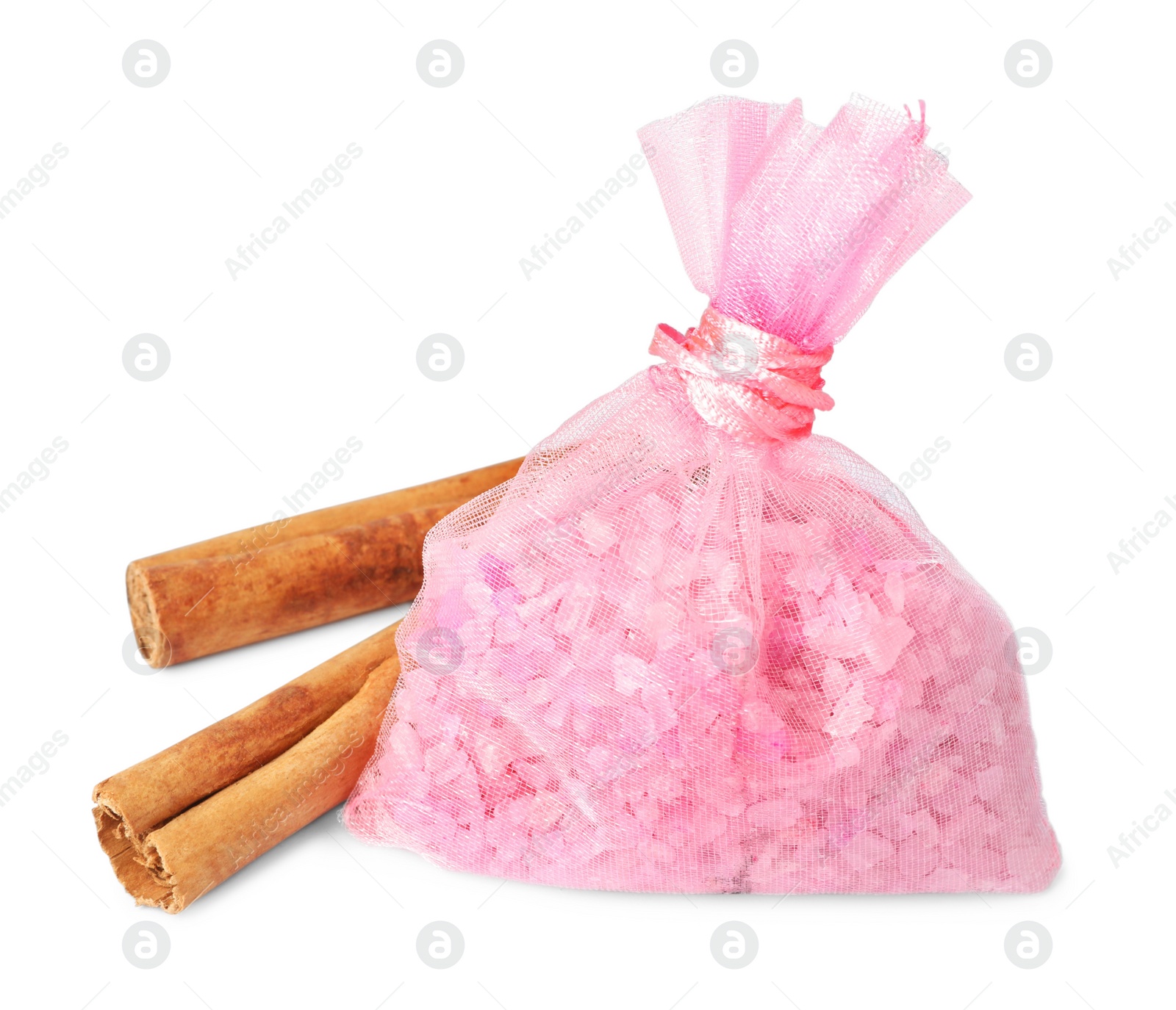 Photo of Scented sachet with aroma beads and cinnamon on white background