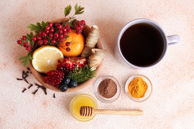 Photo of Flat lay composition with cup of delicious immunity boosting tea and ingredients on color textured background