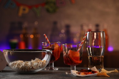 Photo of Messy table with drinks and food leftovers indoors. After party chaos