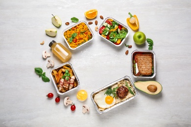 Photo of Frame made of lunchboxes on white wooden table, flat lay with space for text. Healthy food delivery