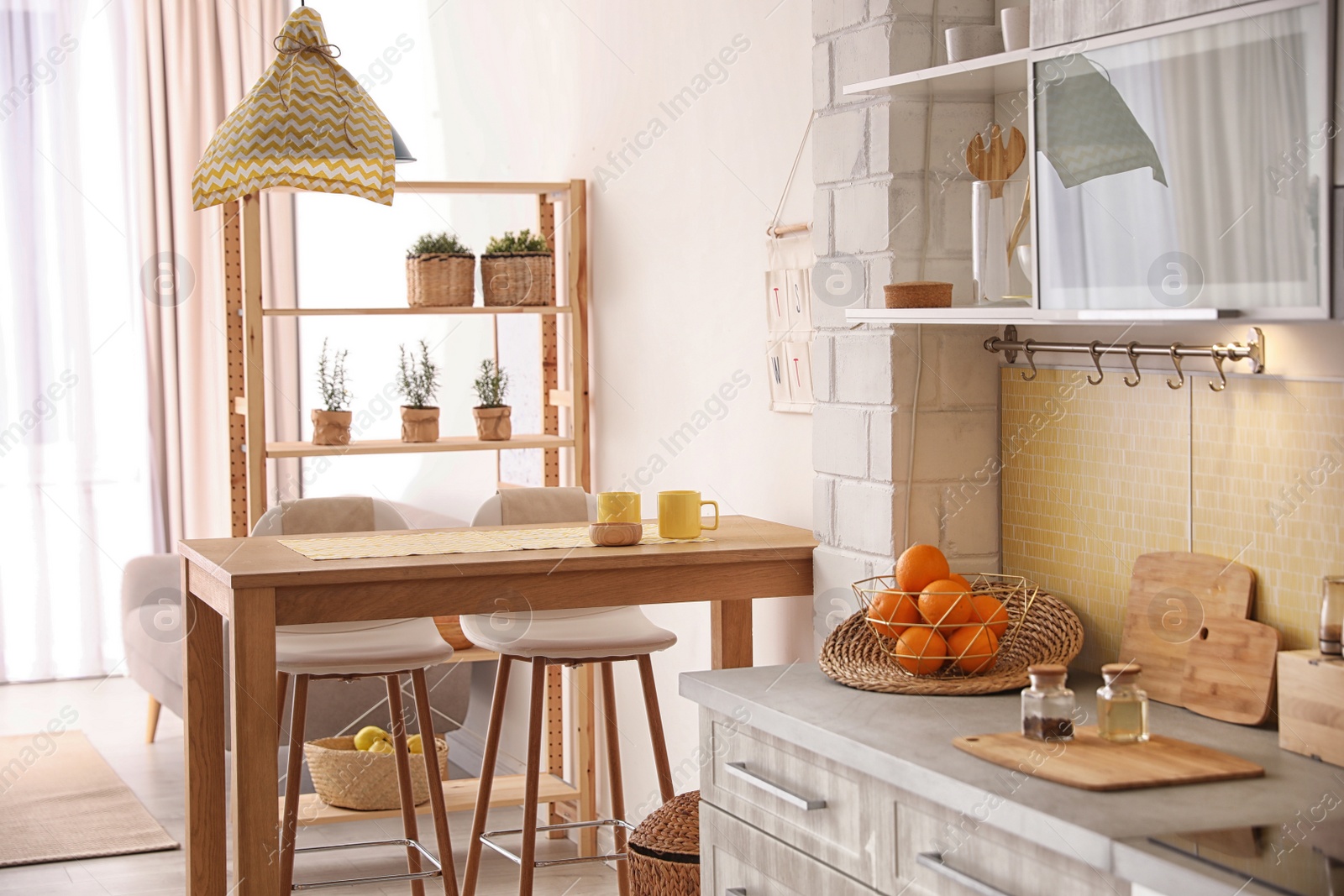 Photo of Modern kitchen interior with stylish wooden table