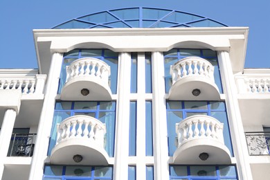 Photo of Exterior of beautiful building with balconies, low angle view
