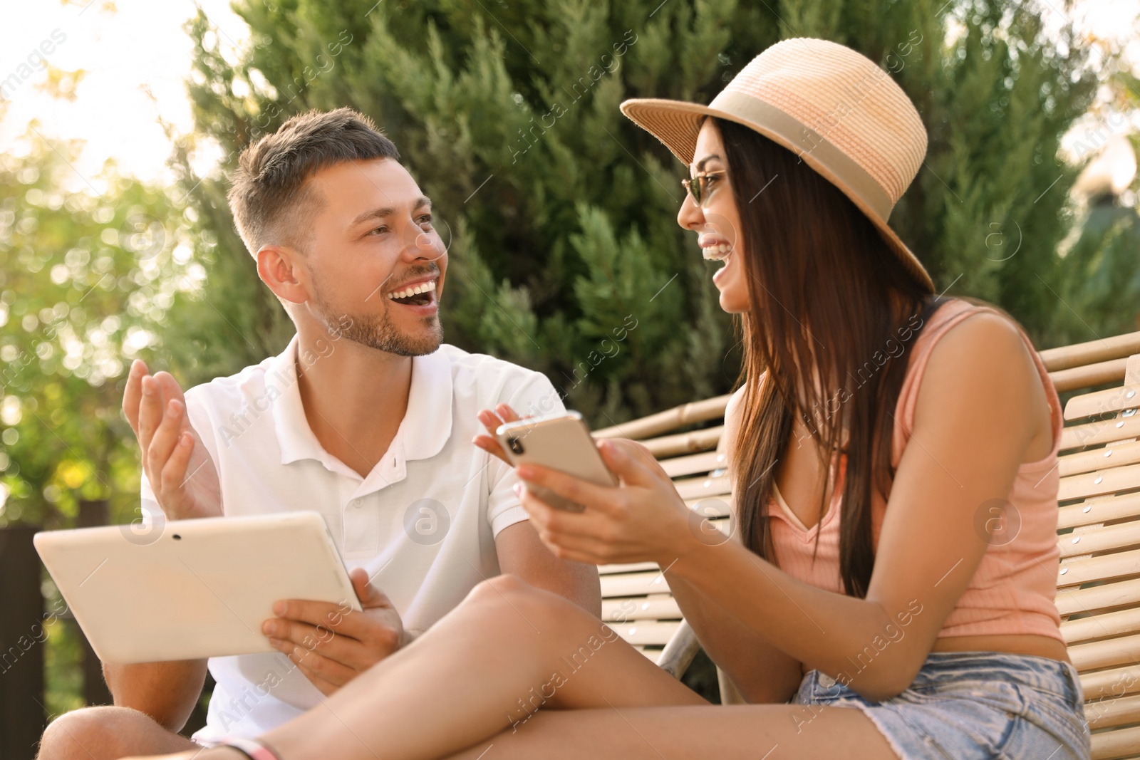 Image of Happy couple spending time together outdoors. Summer vacation