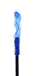 Applicator brush and blue mascara stroke on white background, top view