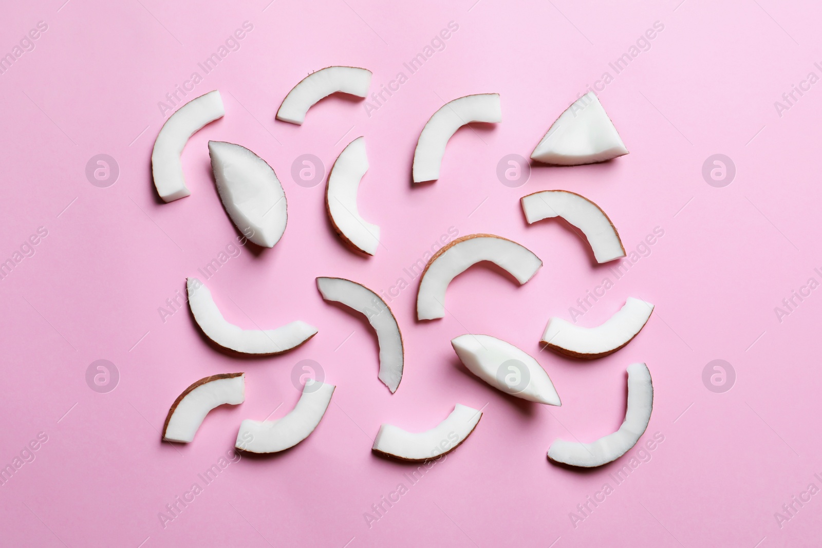 Photo of Coconut pieces on color background