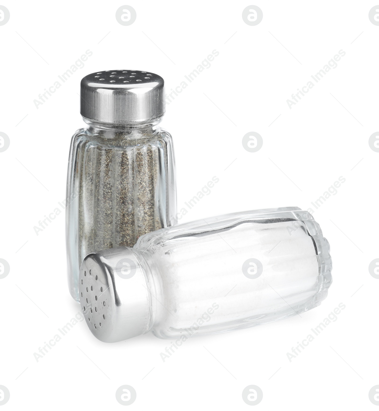 Photo of Salt and pepper shakers on white background