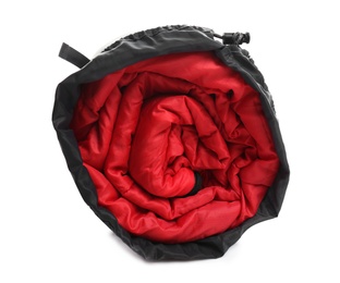 Photo of Sleeping bag in case on white background. Camping equipment