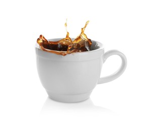Coffee splashing out of cup on white background