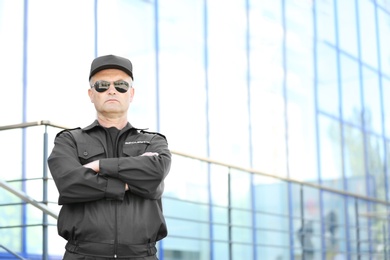 Portrait of male security guard in uniform outdoors