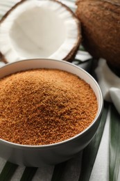 Photo of Natural coconut sugar in bowl on table