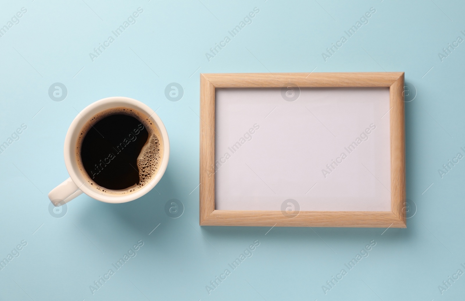 Photo of Blank white board with cup of coffee on turquoise background, flat lay. Space for text