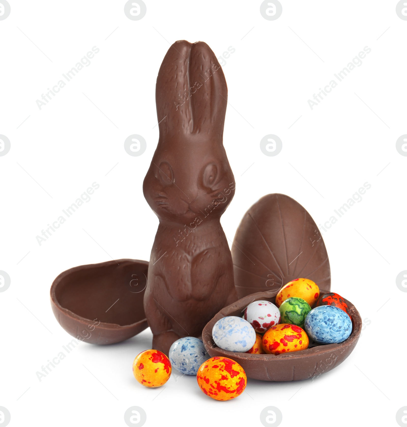 Photo of Chocolate Easter bunny and eggs on white background