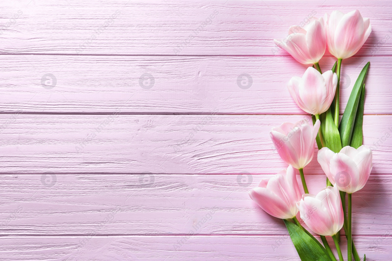 Photo of Beautiful composition with tulips for Mother's Day on wooden background