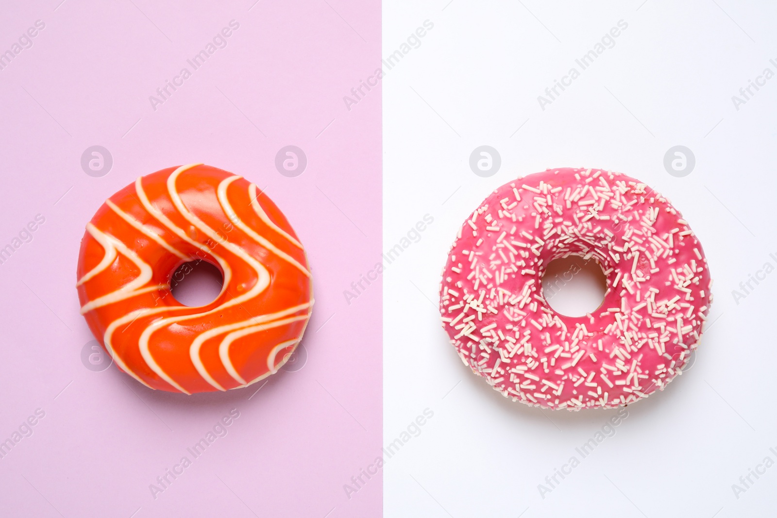 Photo of Delicious glazed donuts on color background, flat lay