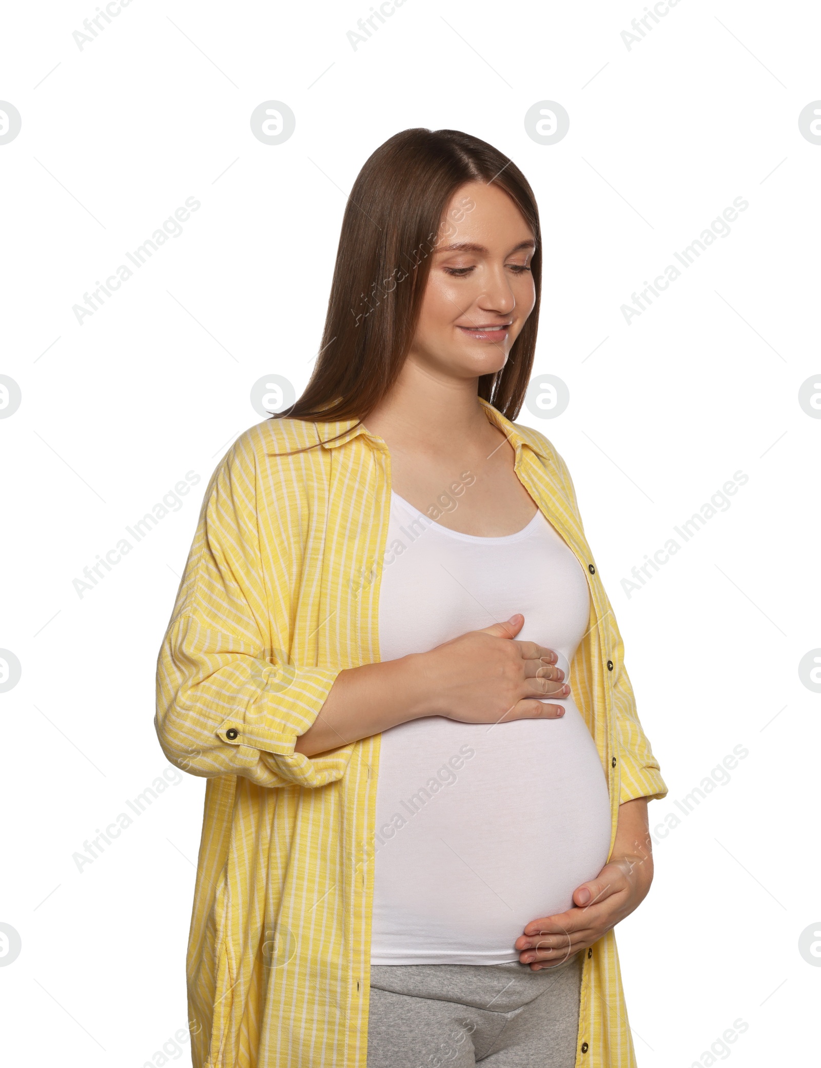 Photo of Happy young pregnant woman isolated on white