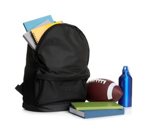 Photo of Backpack, books, football and bottle on white background