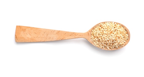 Photo of Wooden spoon with sesame seeds on white background. Different spices