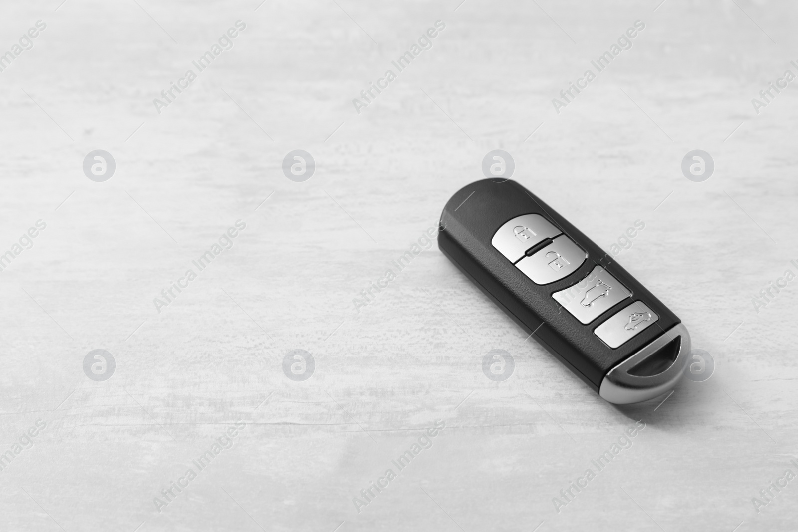 Photo of Remote car key on light background. Space for text