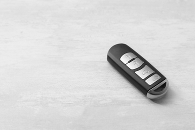 Remote car key on light background. Space for text