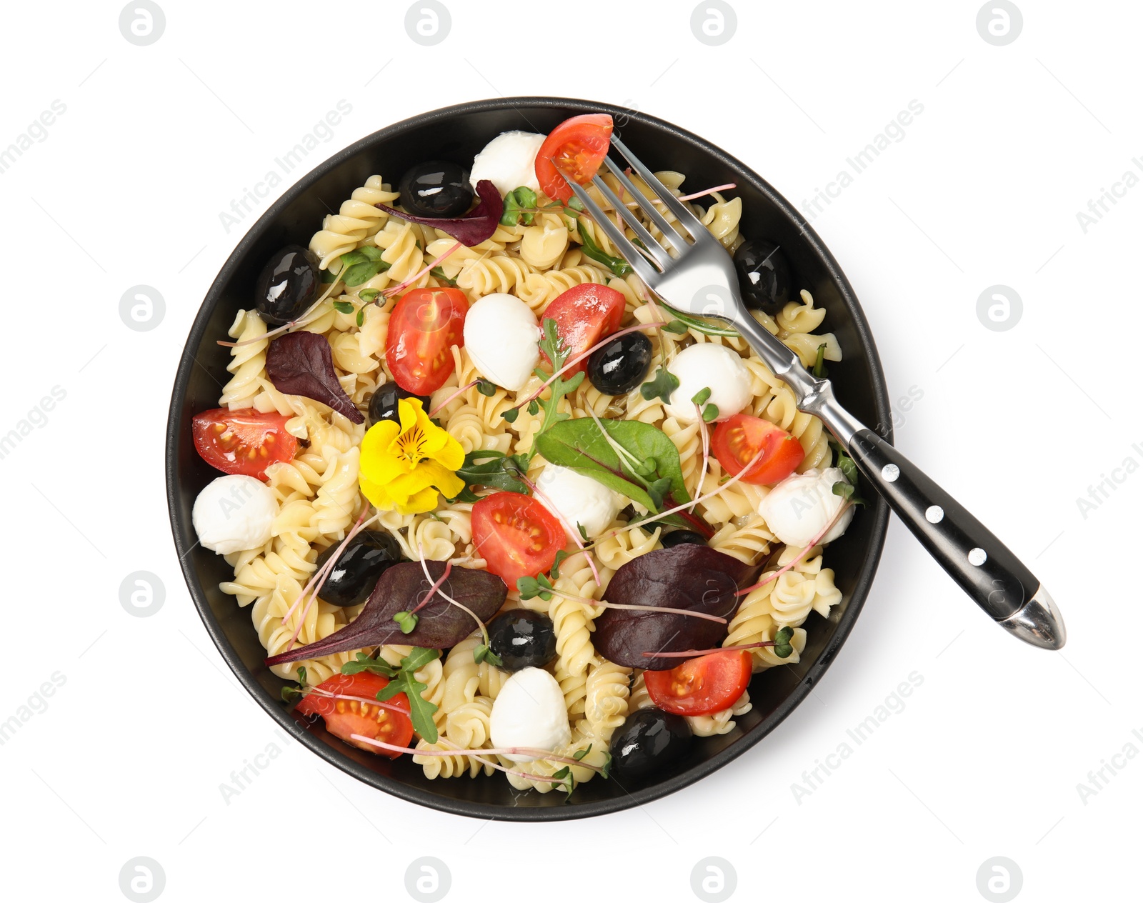 Photo of Bowl of delicious pasta with tomatoes, olives and mozzarella on white background, top view