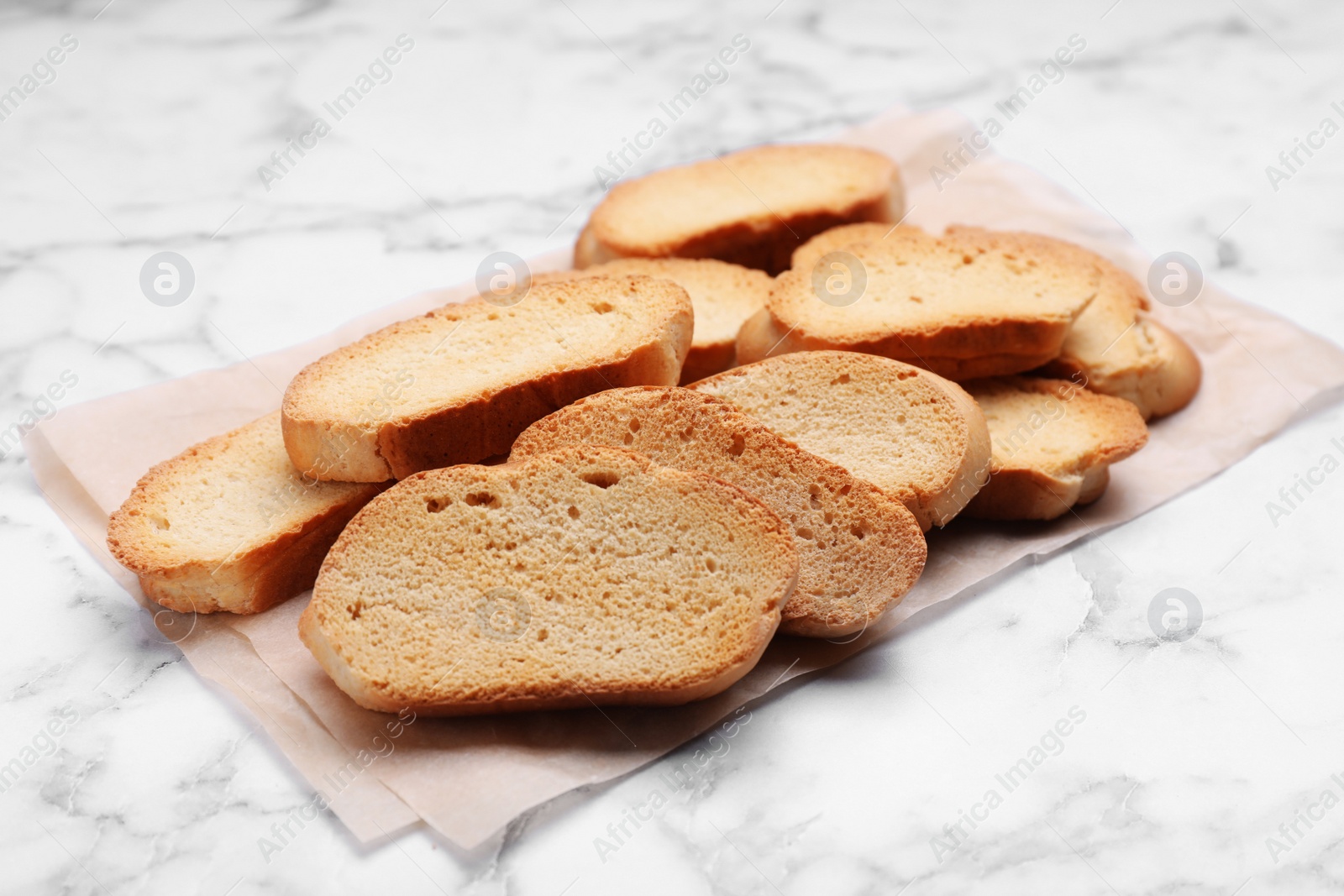 Photo of Hard chuck crackers on white marble table