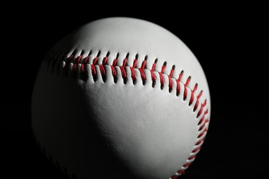 Photo of Baseball ball on black background, closeup. Sports game