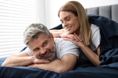 Photo of Lovely mature couple in bed at home