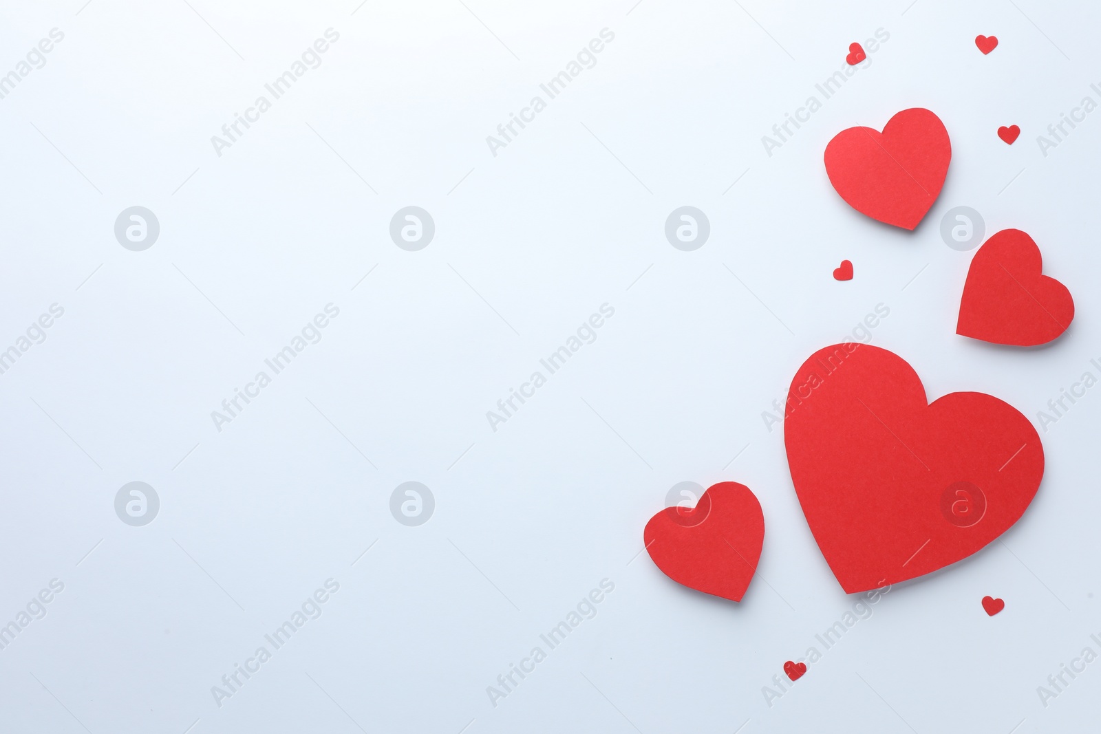 Photo of Paper hearts on white background, flat lay. Space for text