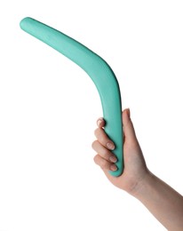 Photo of Woman holding turquoise boomerang on white background, closeup