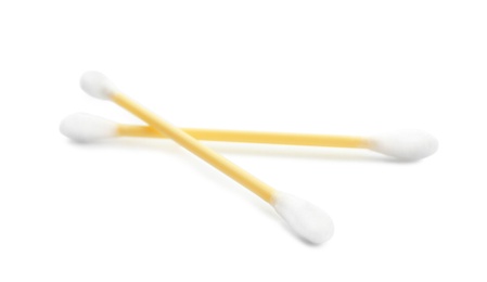 Photo of Yellow plastic cotton swabs on white background