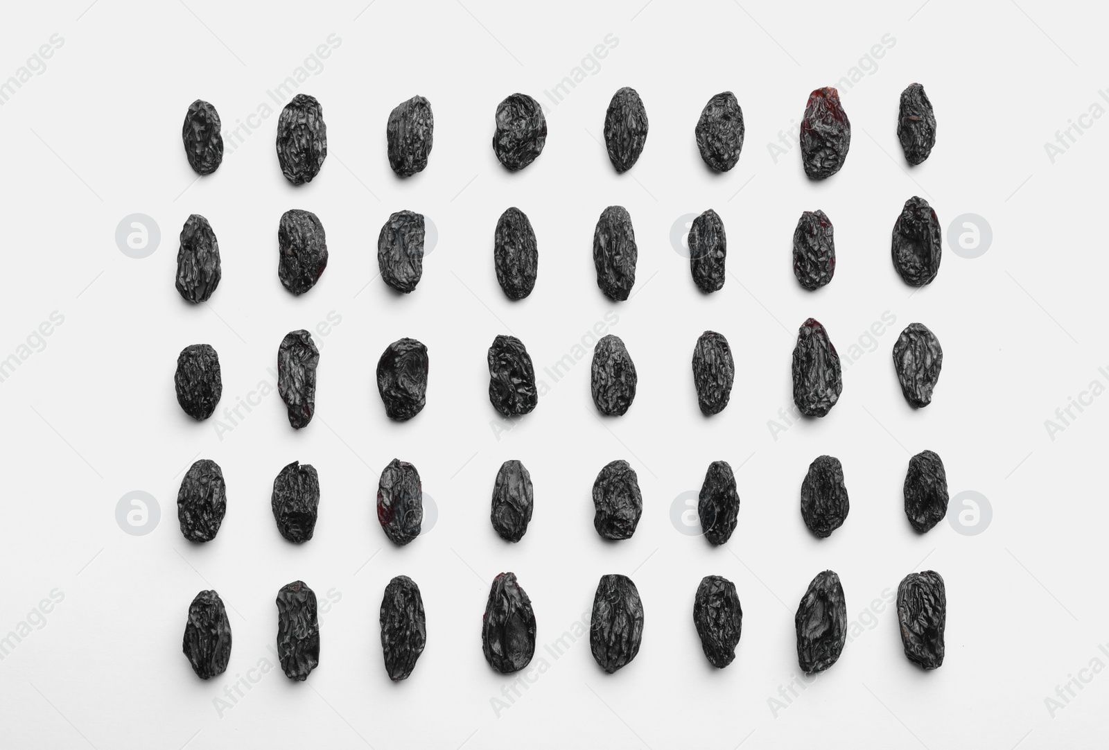 Photo of Composition with raisins on white background, top view. Dried fruit as healthy snack