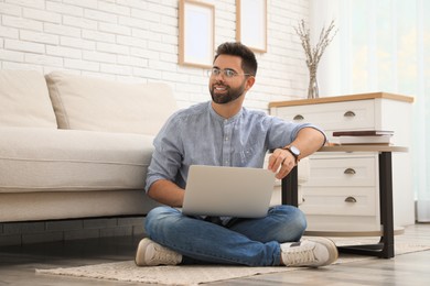 Man using laptop for online shopping at home