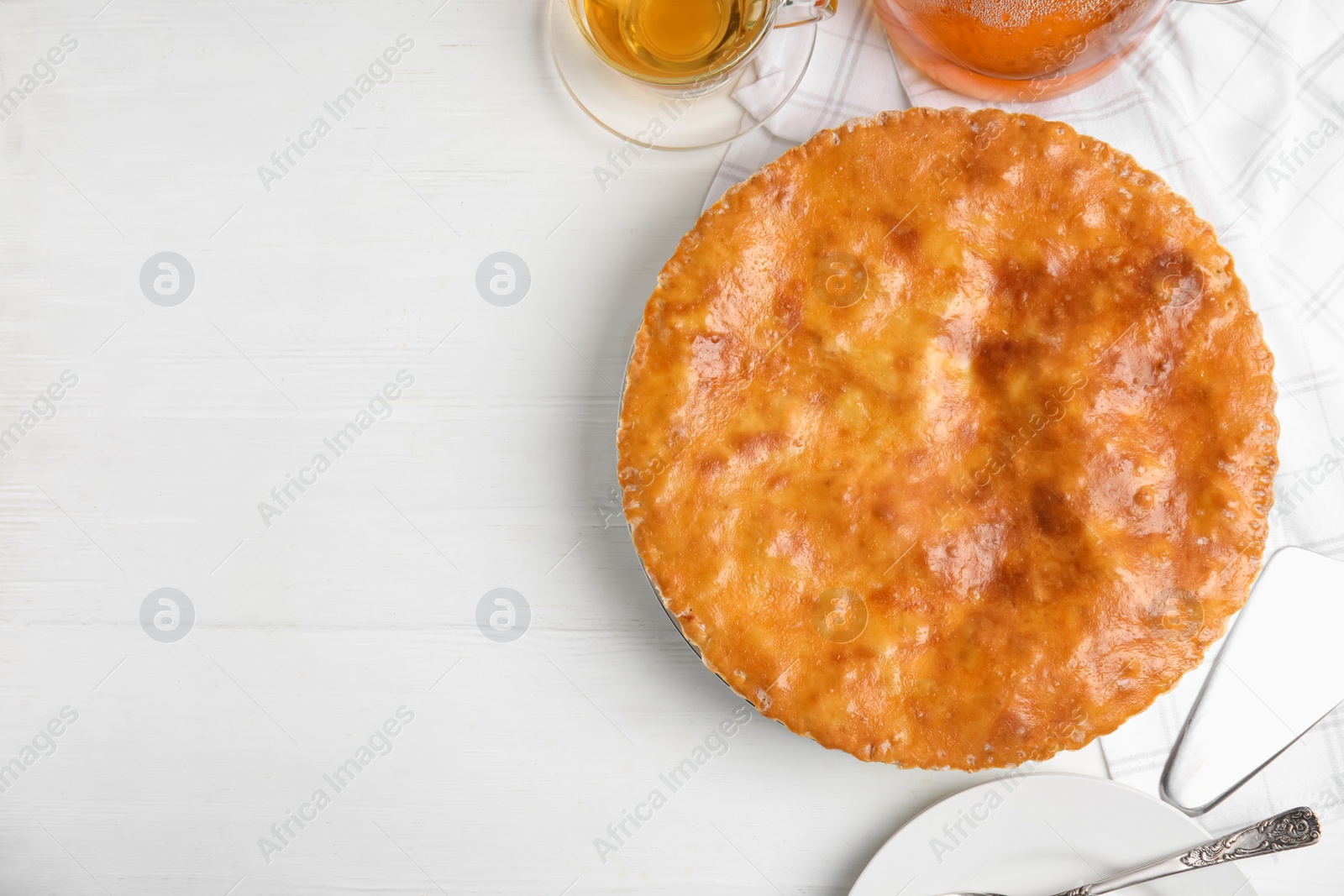 Photo of Delicious pie with meat on white wooden table, flat lay. Space for text