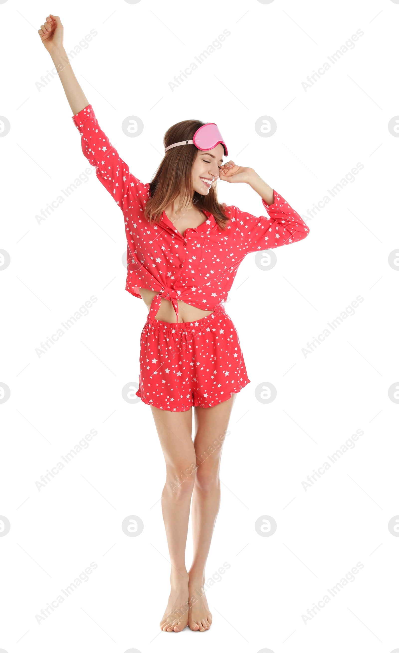 Photo of Beautiful woman wearing pajamas and sleep mask on white background. Bedtime