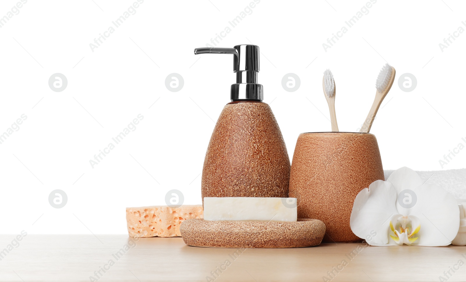 Photo of Bath accessories. Different personal care products and flower on wooden table against white background. Space for text