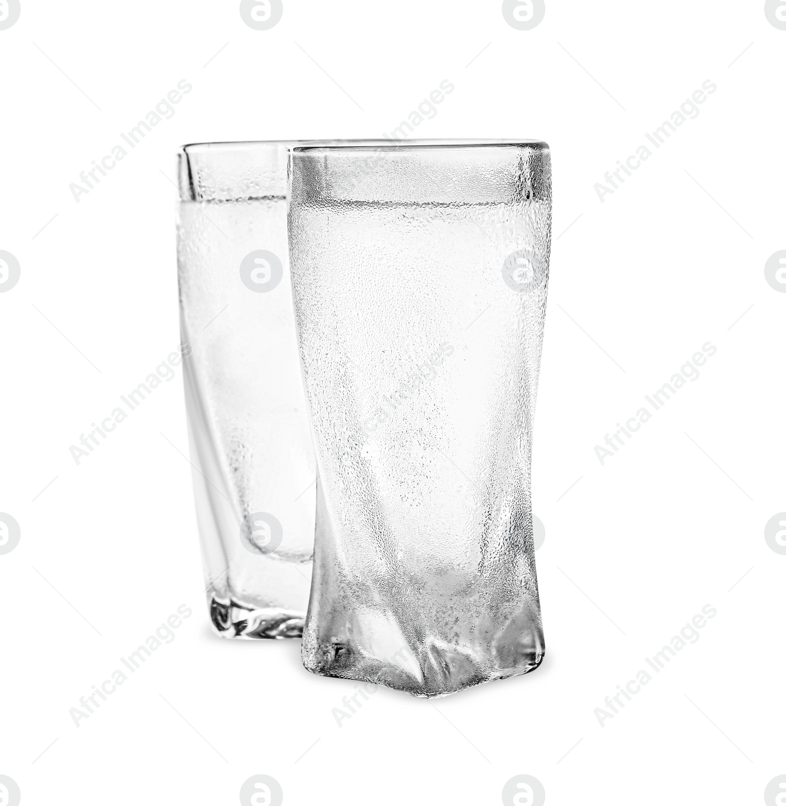 Photo of Vodka in shot glasses on white background