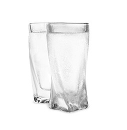 Photo of Vodka in shot glasses on white background