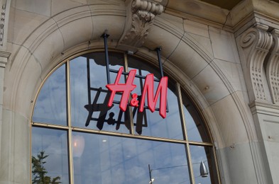Amsterdam, Netherlands - June 18, 2022: H&M fashion store logo on building outdoors