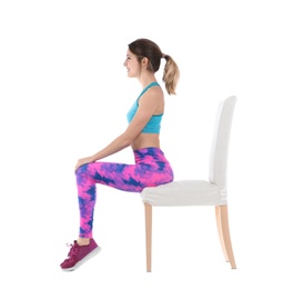 Photo of Young woman resting in chair after sports training on white background. Home fitness