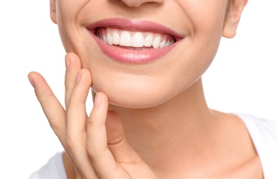 Photo of Young woman with beautiful smile on white background, closeup. Teeth whitening