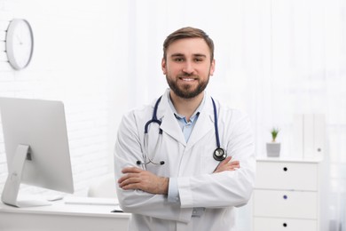 Photo of Portrait of pediatrician with stethoscope in clinic