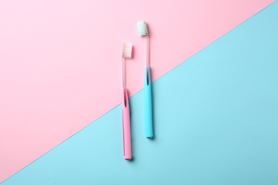 Photo of Manual toothbrushes on color background. Dental care