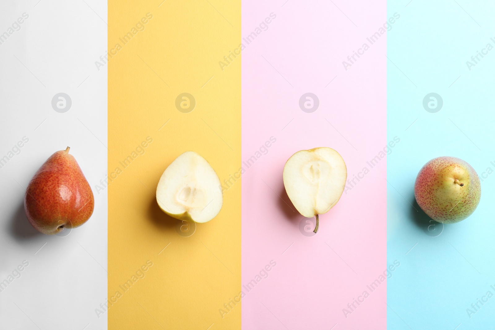 Photo of Ripe juicy pears on color background, flat lay