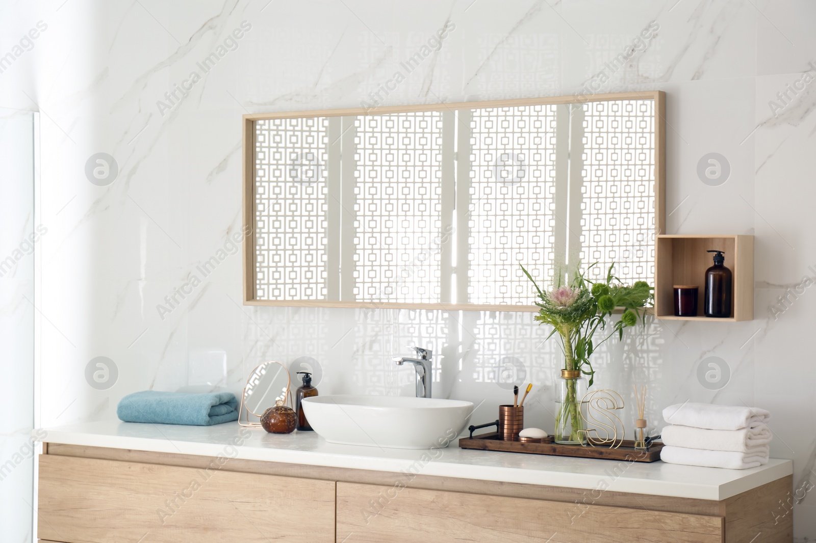 Photo of Modern bathroom interior with stylish mirror and vessel sink