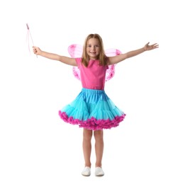 Photo of Cute little girl in fairy costume with pink wings and magic wand on white background