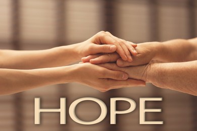 Image of Concept of hope. Caregiver with elderly woman on blurred background, closeup
