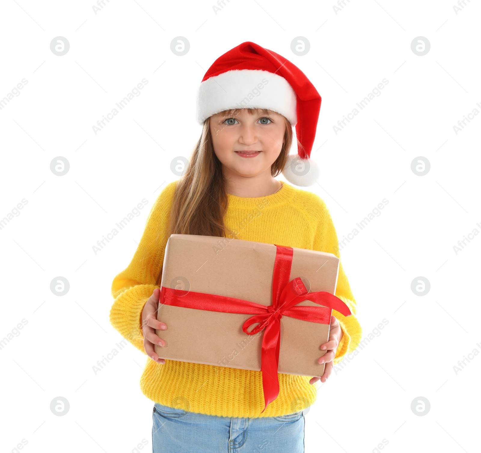 Photo of Cute little girl in Santa hat with Christmas gift on white background