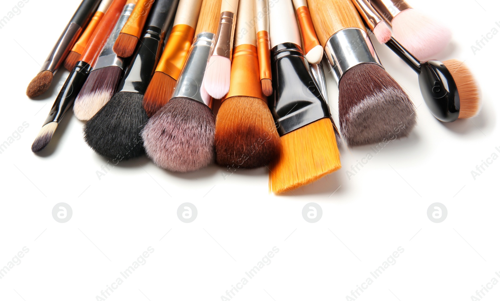 Photo of Makeup brushes of professional artist on white background